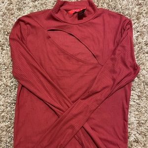 Long sleeved sweater with open chest area